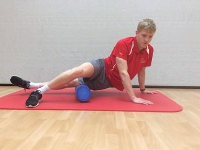 Roll the foam roller from hip to above the knee, working the full length of your thigh.