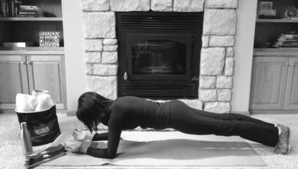4. Plank with Knee Touch Place the Cayman Fitness Loop Band around your wrists, with your palms facing upwards. This helps open up your shoulders. Start in the pushup position.