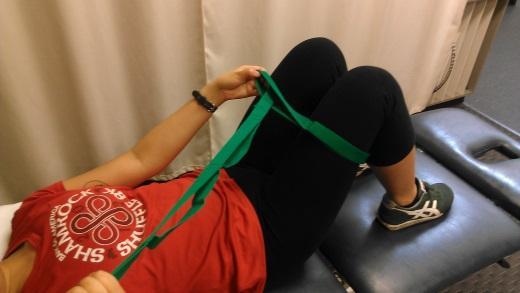 Isometric hip abduction with bridging: Perform supine isometric as described above, with use of Theraband or