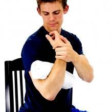 Elbow Towel Stretch Place a small rolled up towel at your elbow joint as shown.