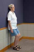 The therapist instructs the participant to contract the gluteal and quadriceps muscles to fully straighten the hip and knee. Begin with a resistance band to achieve around 15 RM.