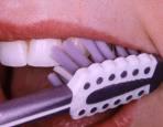 Ease the floss up and down several times, and go below your gumline where all the bacterial action is.