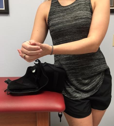 The sling should be open so you can lower the forearm into the support.