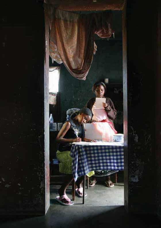 Two girls in a child-headed household where the parents died of AIDS. The HIV epidemic in Mozambique is rated as extreme, with a prevalence rate of 11.5 percent among adults aged 15 to 49.