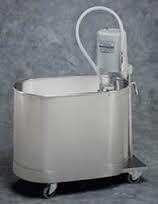 The use of water for therapeutic purposes; usually warm or hot as in a whirlpool