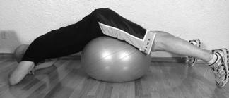 Prone Traction on Pillow/Exercise Ball! Exercise: Lay face down on either an exercise ball or a big stack of pillows underneath your pelvis. Drop your head and shoulders down to the floor.
