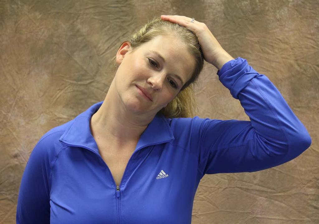 NECK PAIN EXERCISES Upper Trap Stretch Begin by retracting your head back into a chin tuck position.
