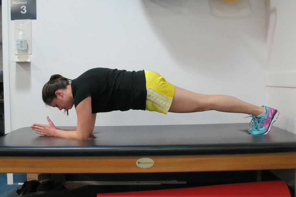 Prone plank Prop up on your forearms and feet.