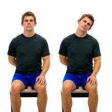 Gently move the ear towards the opposite shoulder until a comfortable stretch