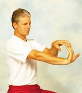 By positioning the hands above the head, you get a better stretch in the arms and hands.