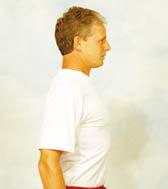 Place back of hands on the wall about chest height, gradually leaning on them while relaxing.
