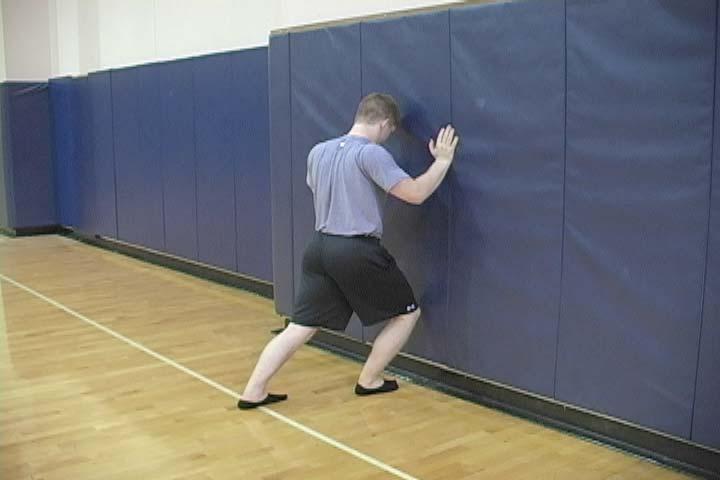 12.2 WALL ANKLE MOBS Purpose To improve ankle mobility into dorsiflexion. Set-up Stand facing a wall, with the toes of one foot directly up against the wall.