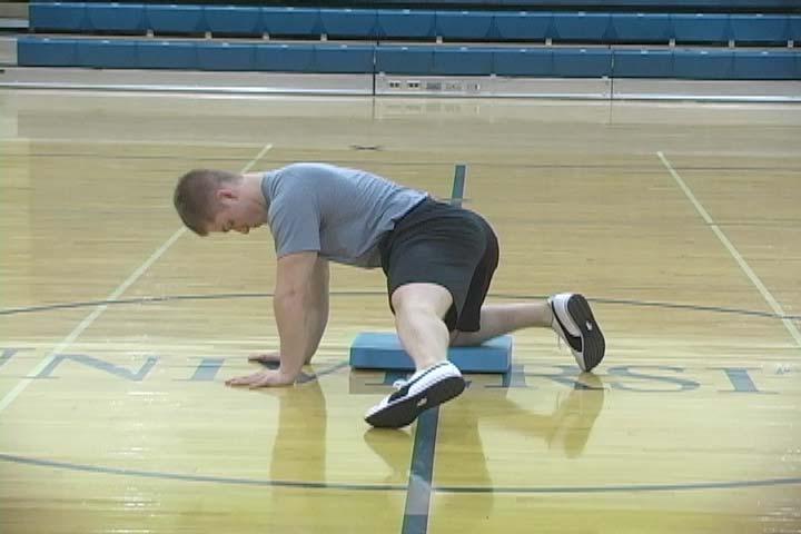 5.4 SPLIT-STANCE HIP SWIVELS Purpose To improve hip external rotation mobility. Set-up Set-up on all fours on the floor, and then put one leg directly out to the side with the knee straight.
