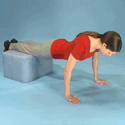 Stage 3 Exercise 13 Lying face down with a cushion/stool under