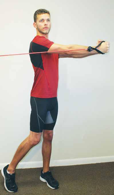 Hold both handles of the resistance band in front of chest with arms extended and shoulders retracted. Brace the abdominals, activate the gluteals and tuck chin in.