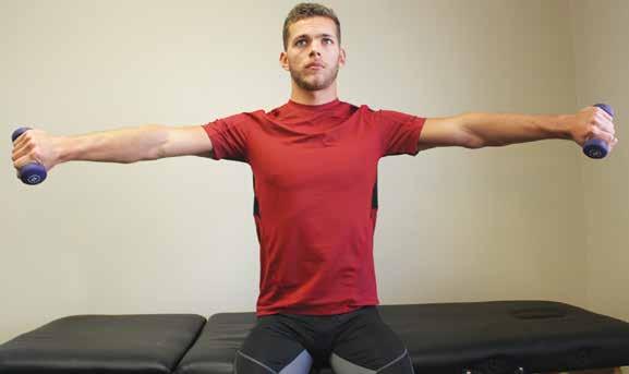 In a seated position, hold light dumb bells in your hands with the palms facing back.