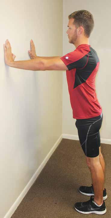 Shoulder Push Press - Wall A. Stand with feet 2 feet away from wall, hands on wall shoulder height, arms straight, shoulders retracted. B.