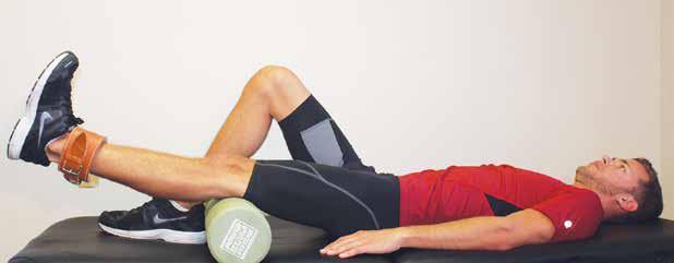 Extend knee Lie supine on a table, bench or mat.