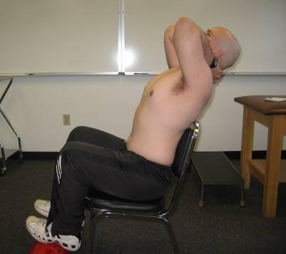THORACIC CENTRALIZATION QUADRUPED FLEXION From a hands and knees position, rock your hips back onto your heels.