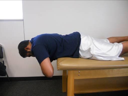 CERVICAL-LUMBAR EXTENSOR TRAINING FOR THORACIC EXTENSION DYSFUNCTION HEAD PRESS Lie down or sit up as directed by your therapist. Place your hands behind your head.