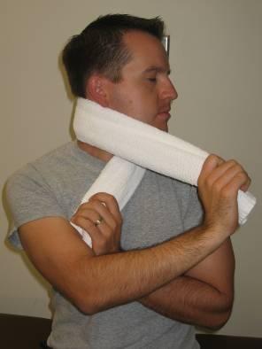 Hold seconds Repeat times TOWEL PULL Wrap a towel around the top of the neck. Pull the towel forward while tucking the chin.