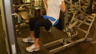 Hammer Strength V-Squats Stand with feet hip distance apart and lean back on the back rest.
