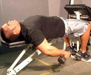 Lying Supine Dumbbell Curl Tips: Lie on a flat bench and start with the dumbbells as far