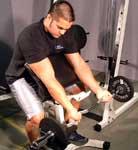 Ezy Bar Preacher Curl Equipment: Barbell Tips: Using a preacher curl bench and an EZ curl bar, make sure the seat is adjusted to the right height.