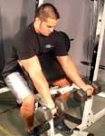 Curl dumbbell up using a semicircular motion until your forearm touches your bicep.