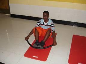 Rowing Exercise and Stretch Sit on the floor with legs bent and feet together.