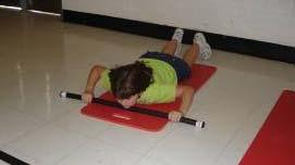 Lower Back Extension Lie on the floor in a prone position with the Body Bar FLEX perpendicular to the body length and chin positioned on surface of the bar (photo A ).