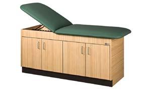 Cabinet Style Treatment Table Wood 4 Door cabinet with full length shelf inside. Natural Oak finish. Leg levelers.