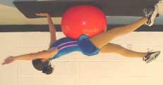 Lie prone over the ball with hands and feet on the floor. B.