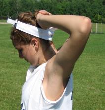 Keeping your elbows straight and out to the side, pull your shoulder blades
