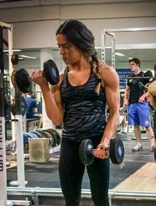 Lift one of the dumbbells in a slow and controlled manner by squeezing your biceps and keeping your