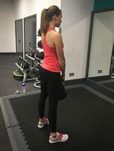 Push your hips backwards and lower the kettle bell keeping it close to your legs at all times.