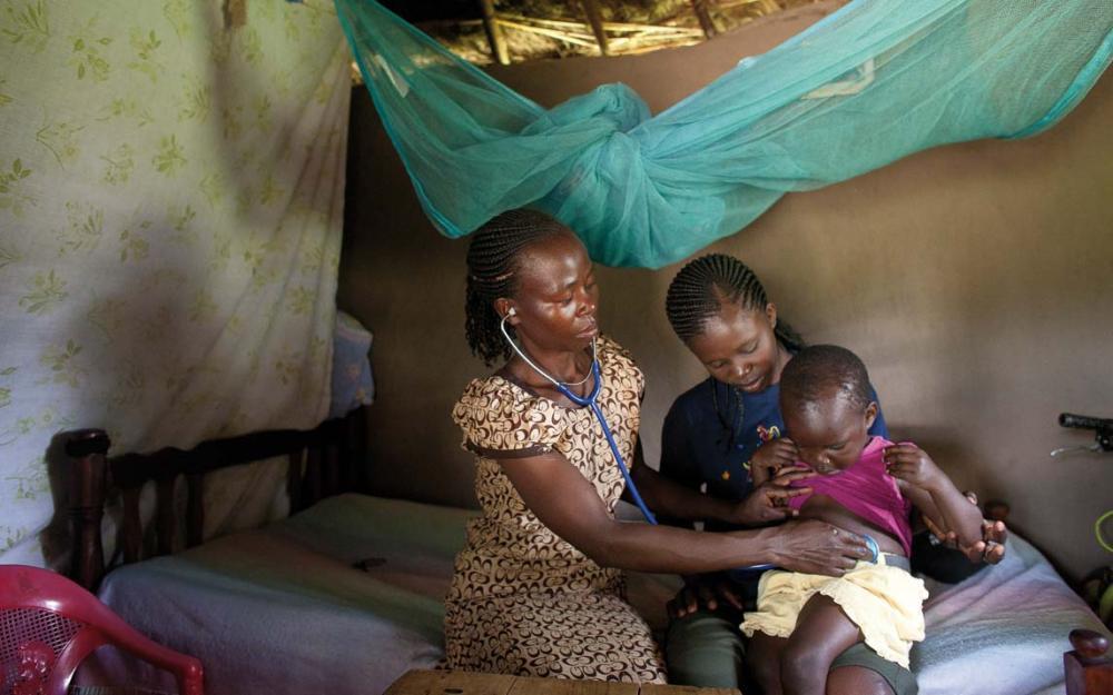 Healthcare workers also play a key role in small, remote villages where they attend to sick children.