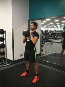 Press the kettle bell overhead keeping your elbows forwards and push your head through your arms as soon as