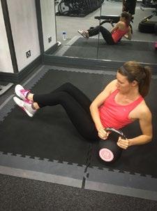 Hold a kettle bell in front of you with your arms bent at the elbows. Keeping your legs still, rotate your upper body from side to side.