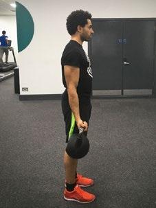 Lift the kettle bell in a slow and controlled manner by squeezing your biceps and keeping your elbow tucked in by your