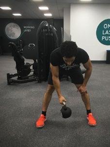 Lift the kettle bell out to the side, keeping a slight bend in your elbow, until your arm is parallel with the floor.