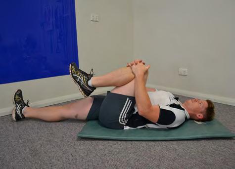 Program Continued Lying Hip Flexor Stretch (hold for 15 seconds per leg) Lying on your back with both knees straight, bring one knee to