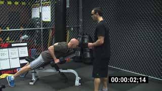 Your arms should hang to the floor. Adjust the bench to the appropriate height.