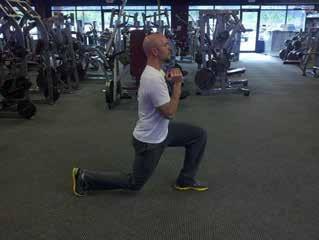 Goblet Lunge Stand with your feet shoulder-width apart. Hold a dumbbell at chest height.