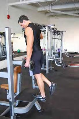 One leg Calf Raise (dumbbell) Standing on a step on the ball of one foot Holding a dumbbell on the same side of