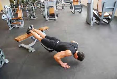 Keep your body rigid like a plank throughout the movement Lower