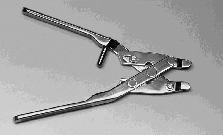 (Figure 2-4) This is a reusable stainless steel instrument used to close the connectors. The Quick Connect Assembly Tool is shipped non-sterile and may be re-sterilized.