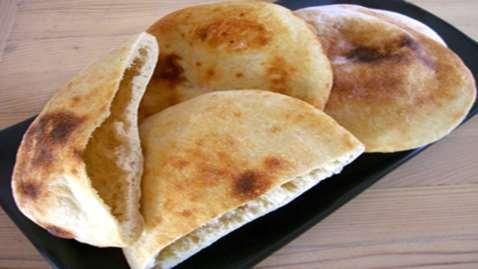 Alpha-amylase maintains and improves flat bread