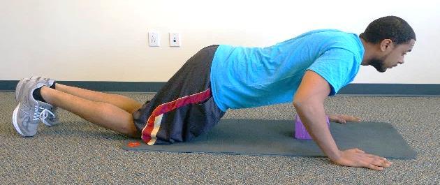 Push-up error knees in contact with test surface.