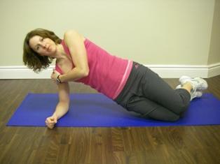 2. Side Bridge - Beginner: Lay on your side, brace abdominals as described earlier, slightly lift the head / shoulders and knees / feet off the ground (just enough to activate the oblique muscles on